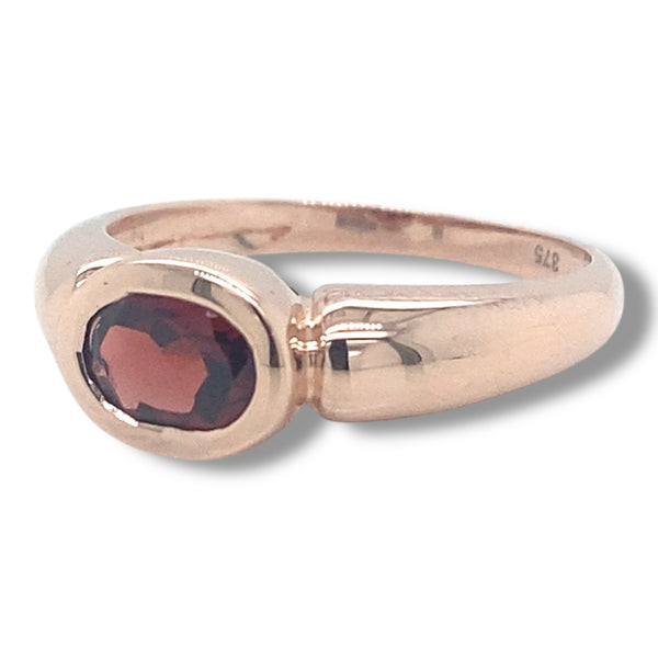 Rose Gold Ring with Bezel Set Garnet in