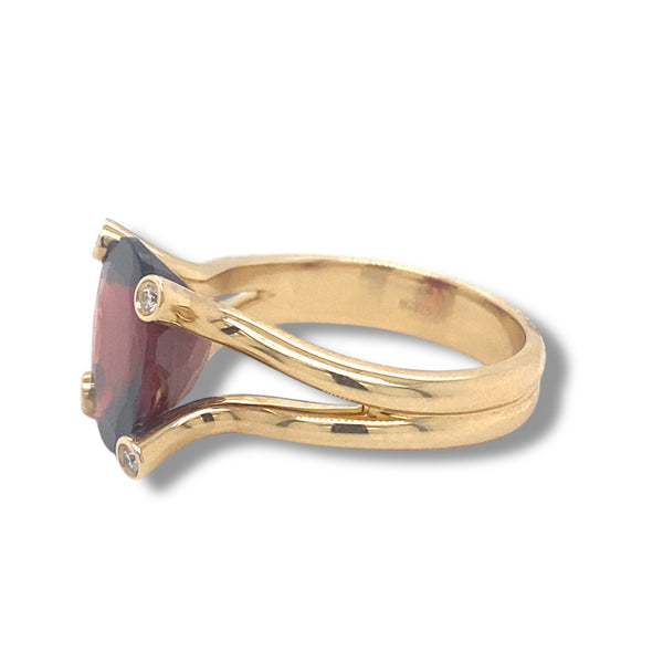 Oval Garnet and Diamond Ring