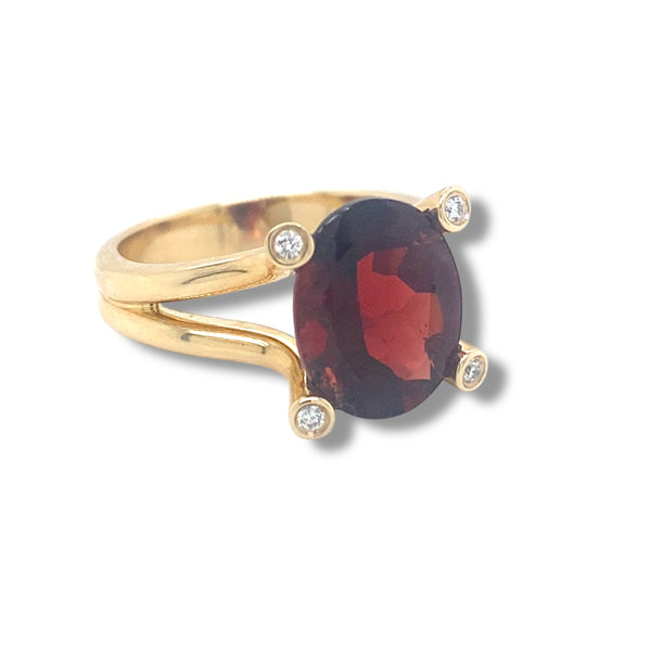 Oval Garnet and Diamond Ring